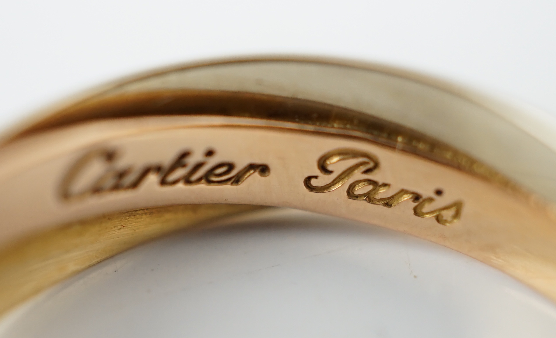 A pair of French Cartier three colour 18ct gold interwoven hoop ear clips